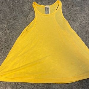 barley worn yellowish tank top